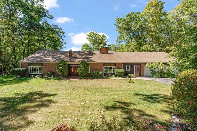 ranch-style house with a front yard and a garage