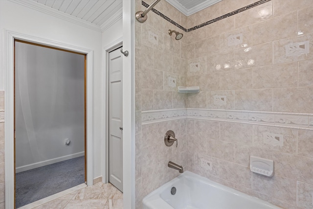 bathroom with tiled shower / bath and crown molding