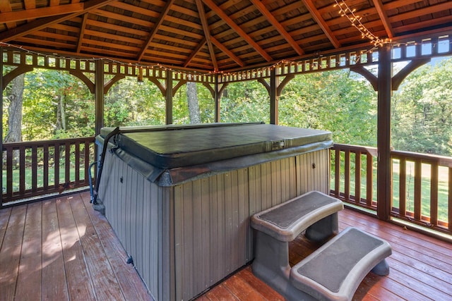 wooden deck featuring a gazebo and a hot tub