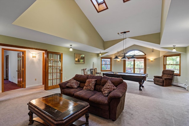 living room featuring pool table, light colored carpet, high vaulted ceiling, a skylight, and baseboard heating