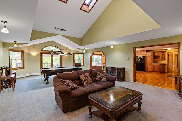 living room with a baseboard heating unit, pool table, carpet floors, high vaulted ceiling, and a skylight