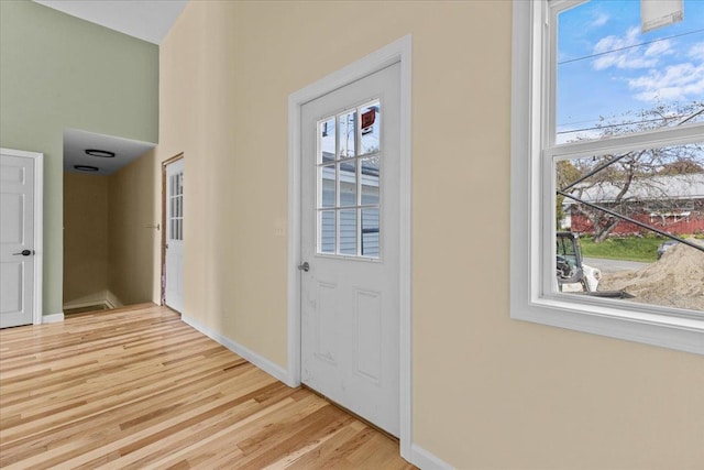 doorway to outside with light hardwood / wood-style floors