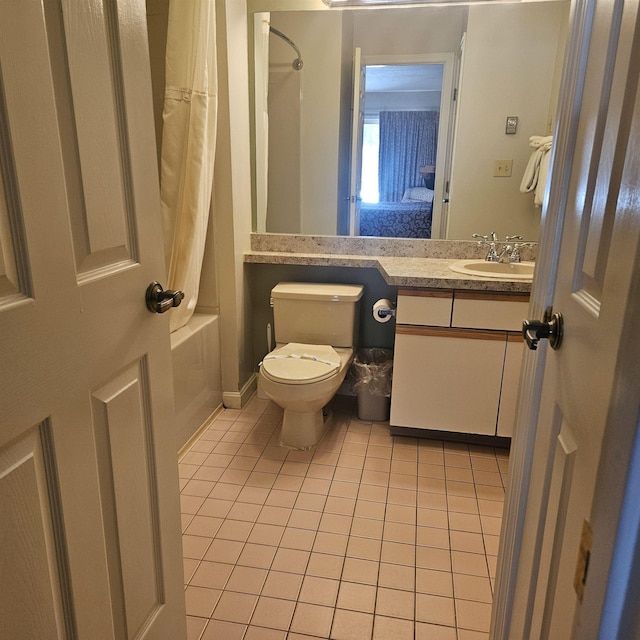 full bathroom featuring tile patterned floors, shower / tub combo with curtain, vanity, and toilet