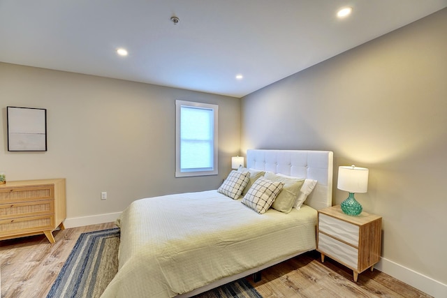 bedroom with hardwood / wood-style flooring