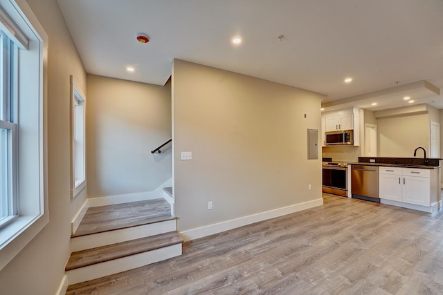 interior space featuring sink and hardwood / wood-style floors