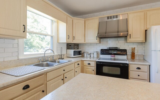 kitchen with light brown cabinets, sink, white appliances, and range hood