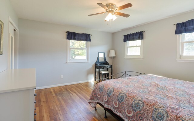 bedroom featuring ceiling fan and hardwood / wood-style floors