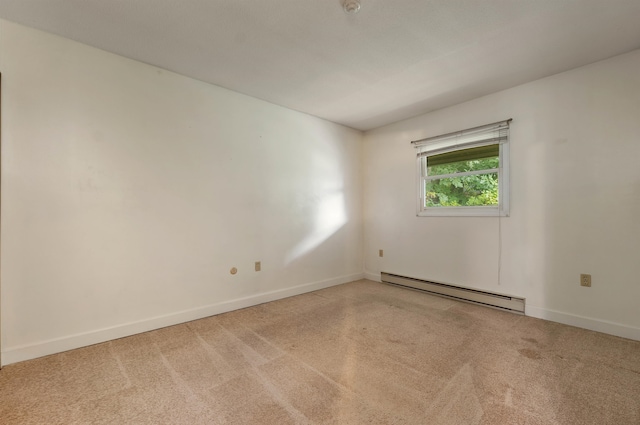 carpeted empty room with a baseboard radiator