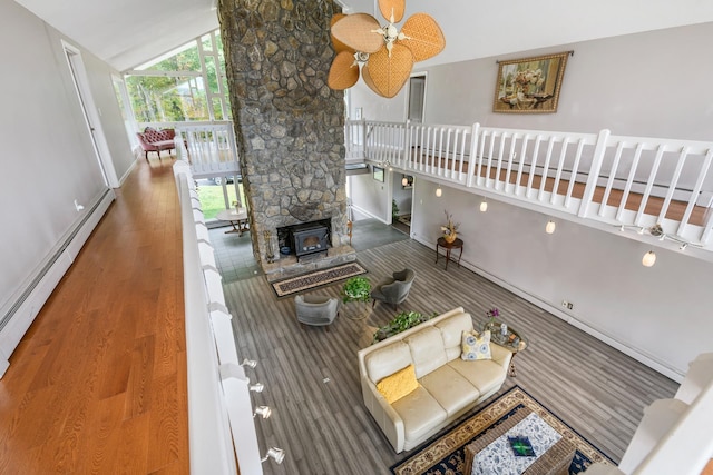 wooden terrace with a baseboard heating unit