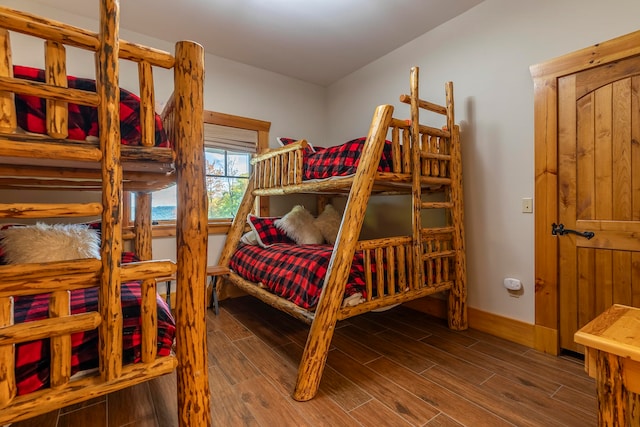 bedroom featuring dark wood-type flooring