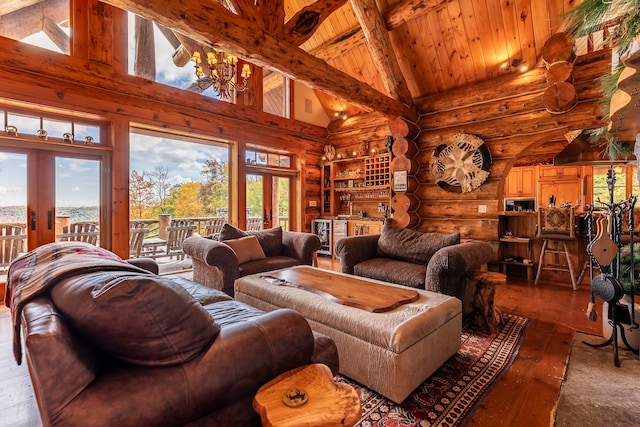 living room featuring french doors, wood-type flooring, plenty of natural light, and high vaulted ceiling