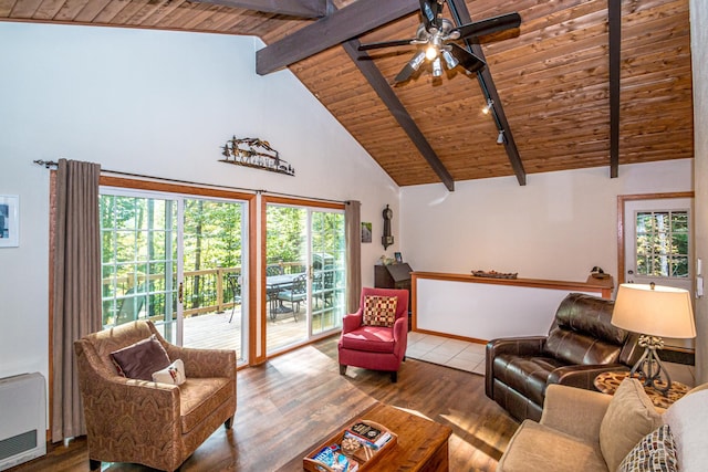 living room featuring high vaulted ceiling, wood ceiling, hardwood / wood-style flooring, and a healthy amount of sunlight