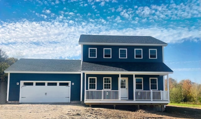 view of front of home featuring a porch and a garage