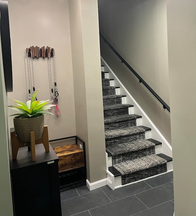 staircase with tile patterned floors