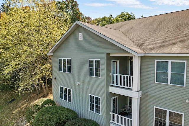 view of side of property with a balcony