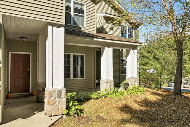 doorway to property featuring a porch