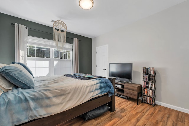 bedroom featuring wood-type flooring