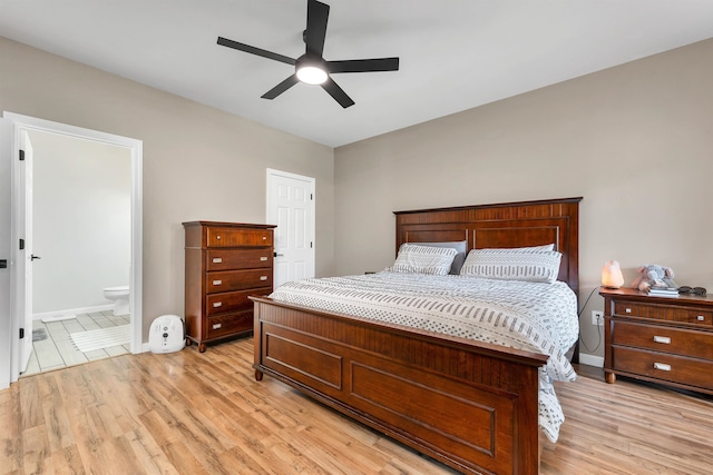 bedroom with light wood-type flooring, ensuite bath, and ceiling fan