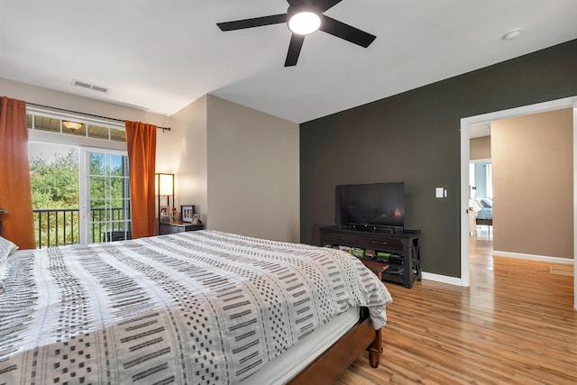 bedroom with ceiling fan, light hardwood / wood-style flooring, and access to exterior