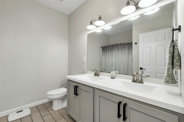 bathroom with hardwood / wood-style floors, vanity, toilet, and a shower with shower curtain