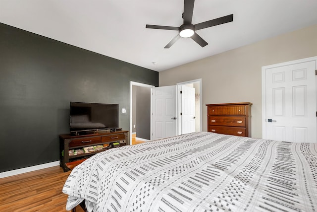 bedroom featuring hardwood / wood-style floors and ceiling fan