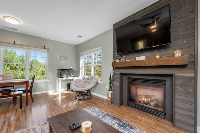 living room featuring hardwood / wood-style flooring and a fireplace