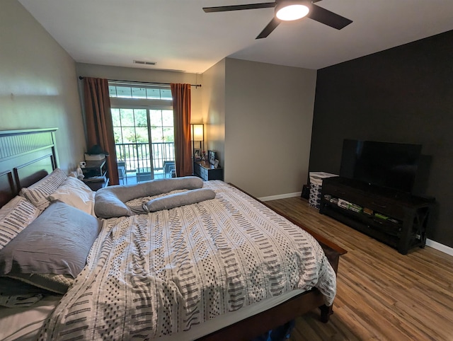 bedroom featuring wood-type flooring, ceiling fan, and access to outside