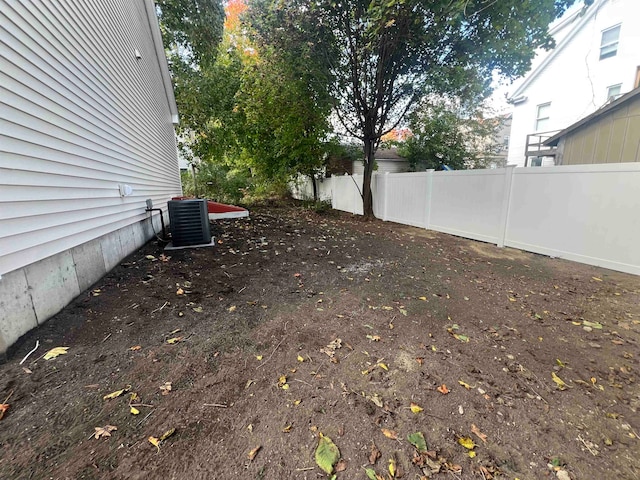 view of yard with central AC unit