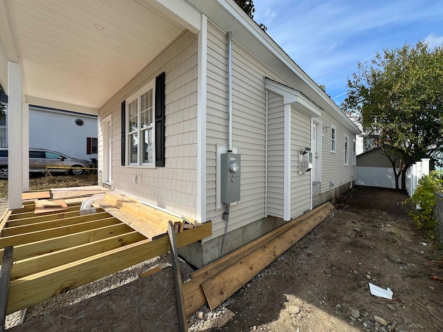 view of side of property featuring a porch