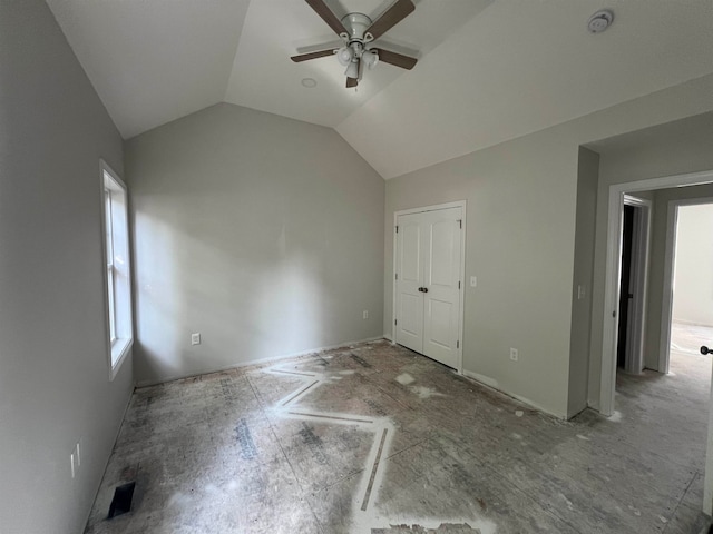 additional living space with ceiling fan and vaulted ceiling