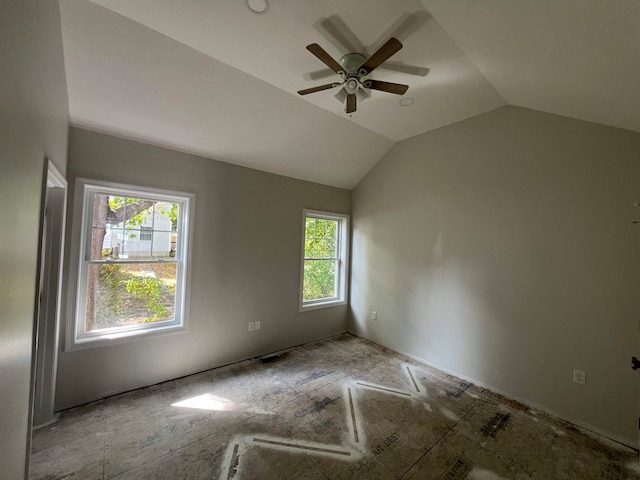 unfurnished room with ceiling fan and lofted ceiling