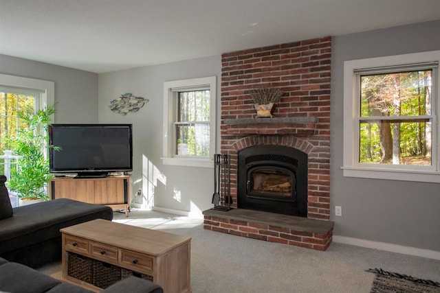 living room featuring light colored carpet and a wealth of natural light