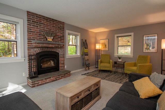 carpeted living room with a brick fireplace