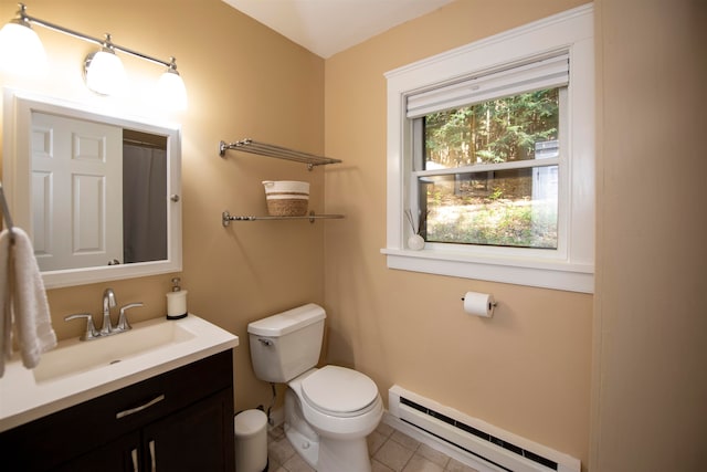 bathroom featuring vanity, toilet, a baseboard heating unit, and tile patterned floors