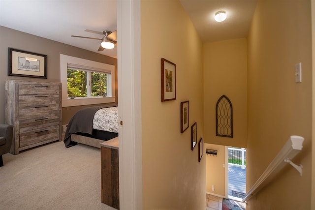 carpeted bedroom with ceiling fan