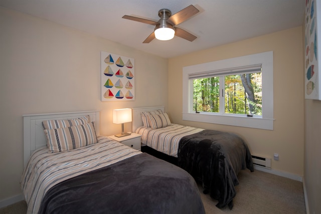 bedroom featuring ceiling fan, baseboard heating, and carpet flooring