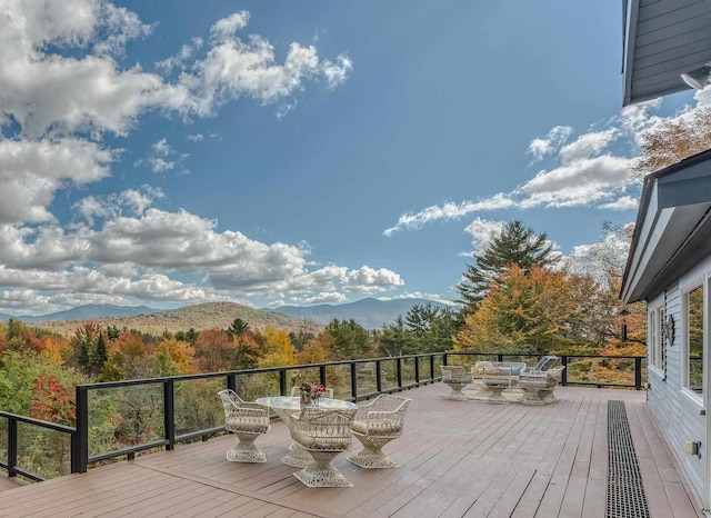 428 Pearl Lake Rd, Sugar Hill, NH 03586 - wooden terrace with a mountain view and outdoor dining space