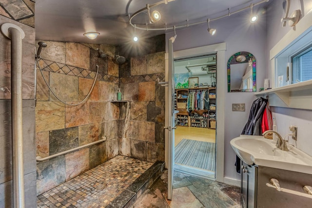 428 Pearl Lake Rd, Sugar Hill, NH 03586 - bathroom with a tile shower, vanity, and stone finish floors