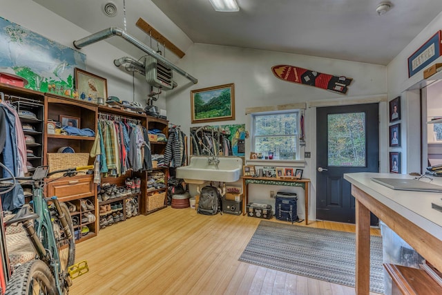 interior space with vaulted ceiling and light wood-type flooring