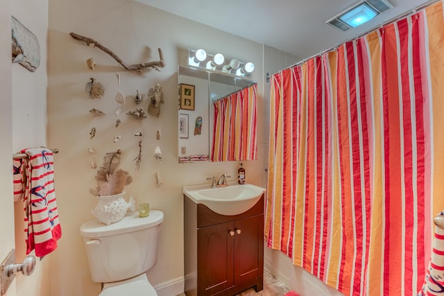 full bathroom featuring vanity, toilet, and shower / tub combo