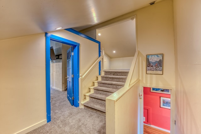 staircase with carpet flooring