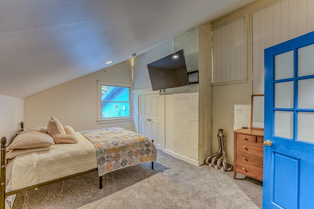 bedroom with light carpet and vaulted ceiling