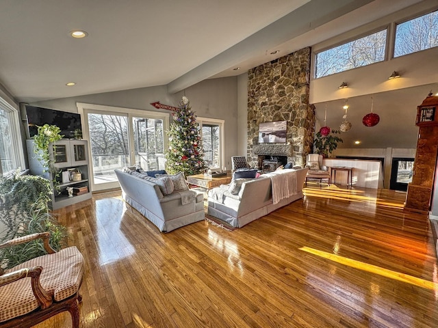428 Pearl Lake Rd, Sugar Hill, NH 03586 - living room with a fireplace, hardwood / wood-style floors, vaulted ceiling, and recessed lighting