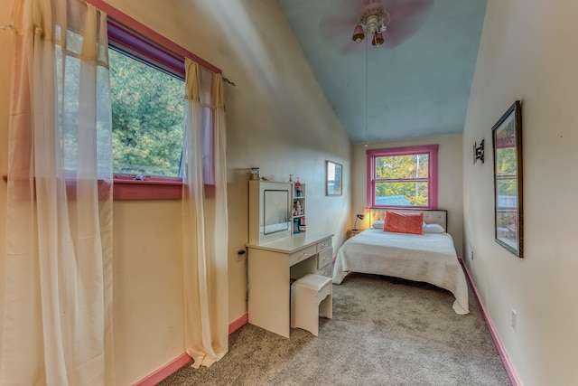 bedroom with carpet, ceiling fan, and vaulted ceiling