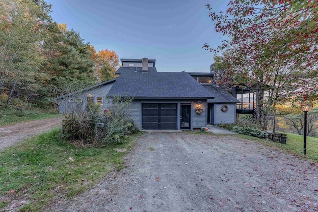 428 Pearl Lake Rd, Sugar Hill, NH 03586 - mid-century inspired home featuring dirt driveway, a shingled roof, an attached garage, and a chimney