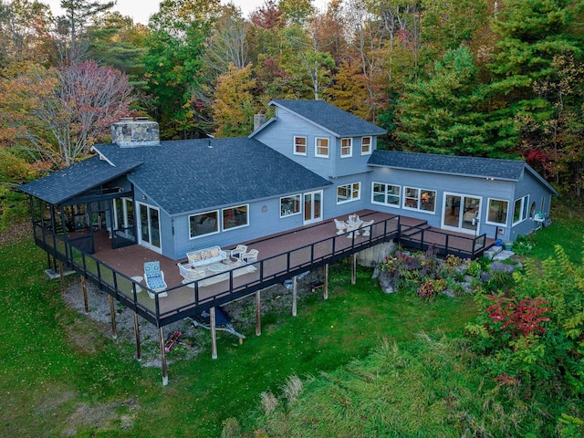 428 Pearl Lake Rd, Sugar Hill, NH 03586 - back of house featuring a wooden deck, a shingled roof, a lawn, and an outdoor hangout area