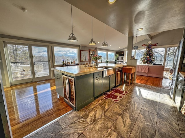 428 Pearl Lake Rd, Sugar Hill, NH 03586 - kitchen featuring light countertops, stainless steel dishwasher, decorative light fixtures, vaulted ceiling, and recessed lighting
