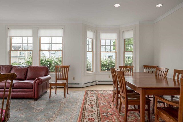 dining space with crown molding