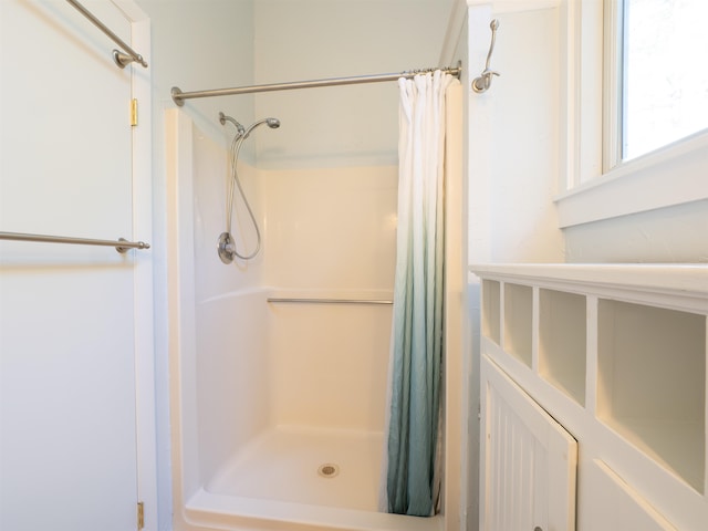 bathroom with a shower with shower curtain