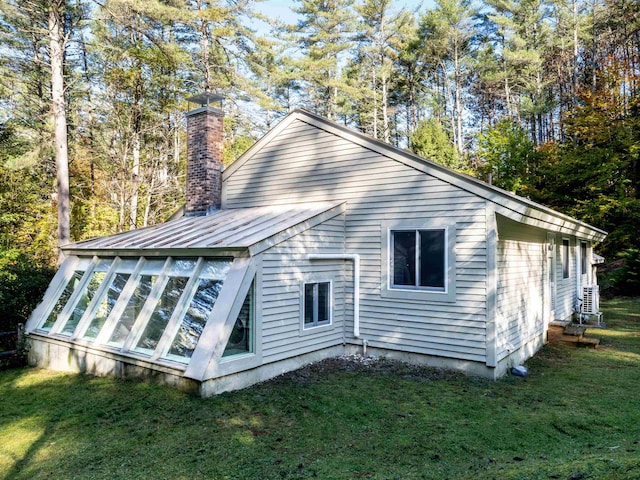 view of property exterior featuring a yard